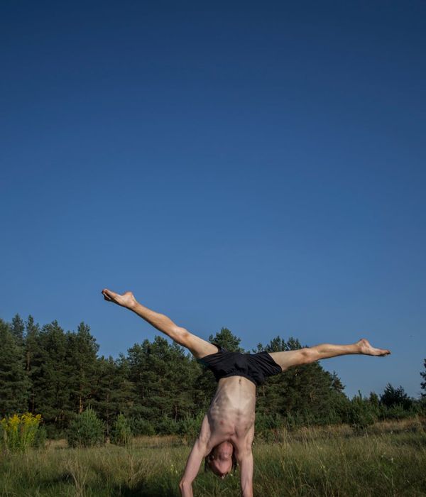 Man performing a controlled strength exercise in a calm setting.